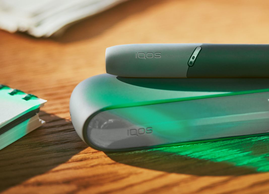 IQOS 3 next to coffee cups