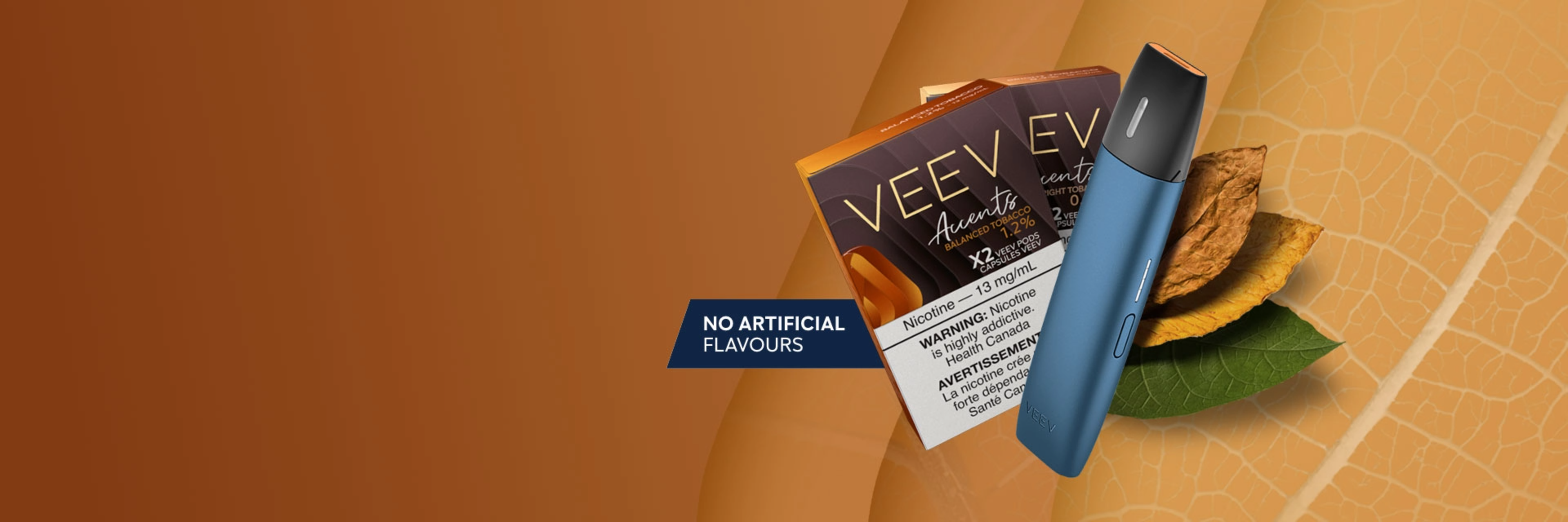 A gold VEEV vape device with 3 packs of VEEV pods on a turquoise platform.