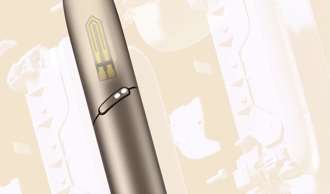IQOS 3 DUO holder in brilliant gold showing the heating blade