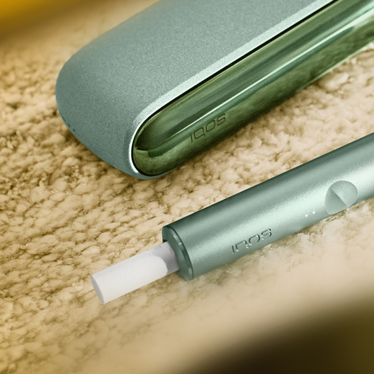 An IQOS ILUMA PRIME Holder and Pocket Charger.