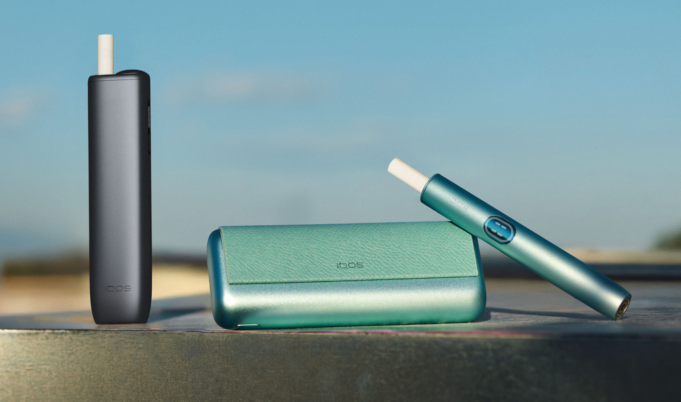 A Jade Green IQOS ILUMA PRIME Pocket Charger and Holder.