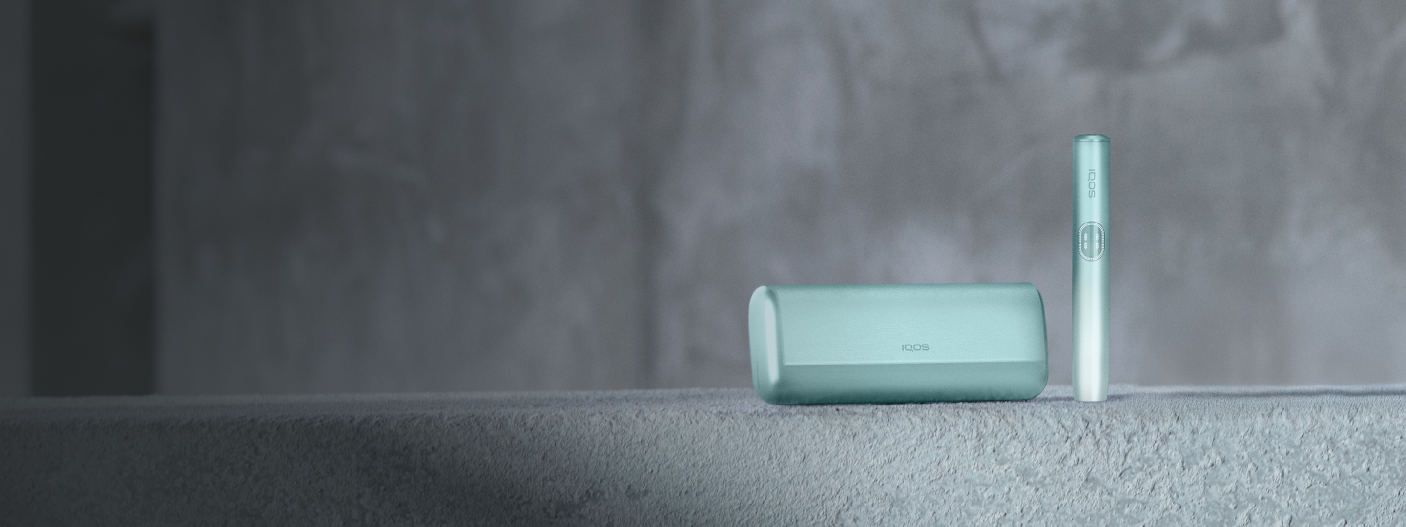 A Jade Green IQOS ILUMA i PRIME Pocket Charger and Holder.