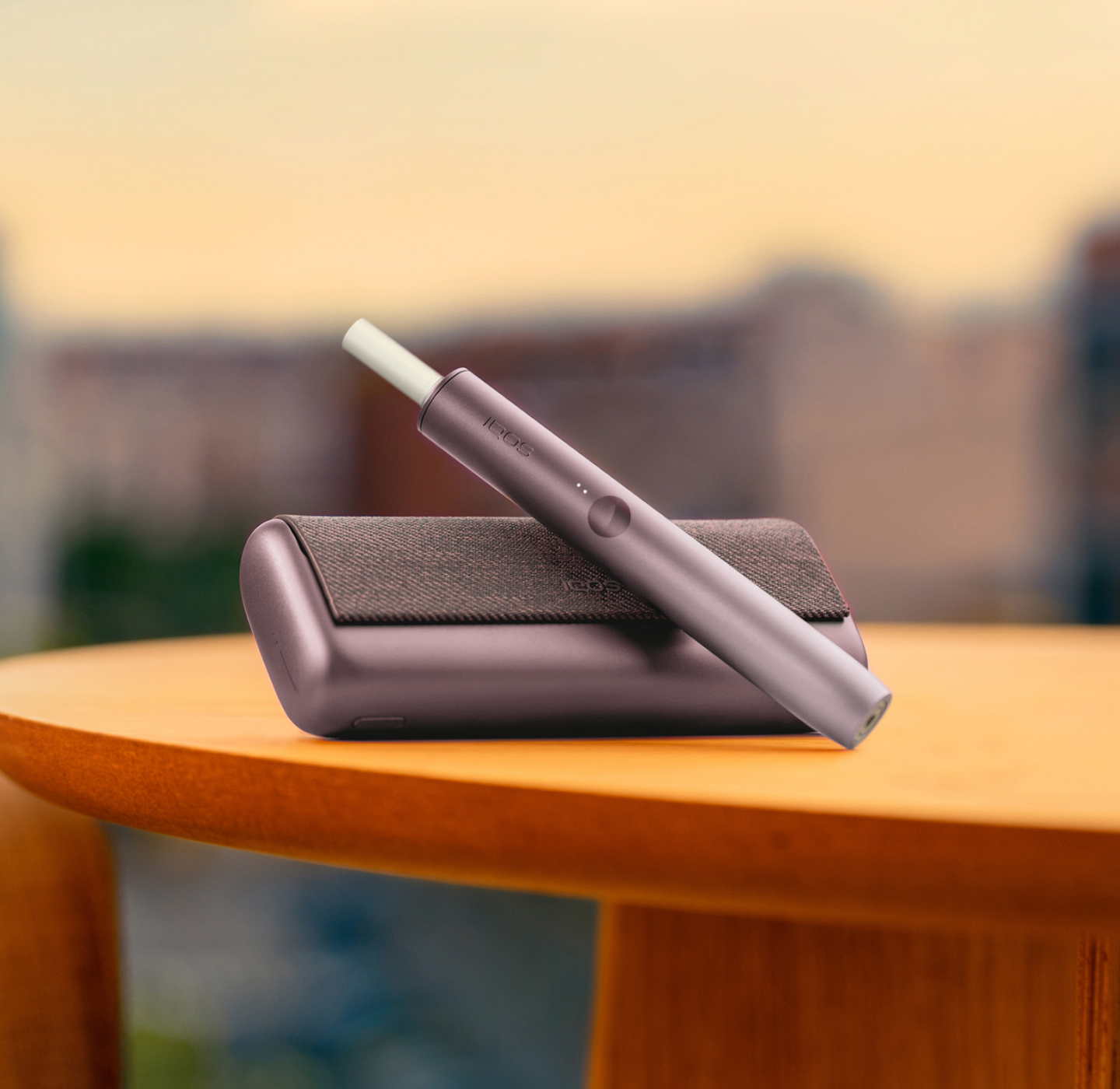 A jade green IQOS ILUMA PRIME Pocket Charger and Holder.