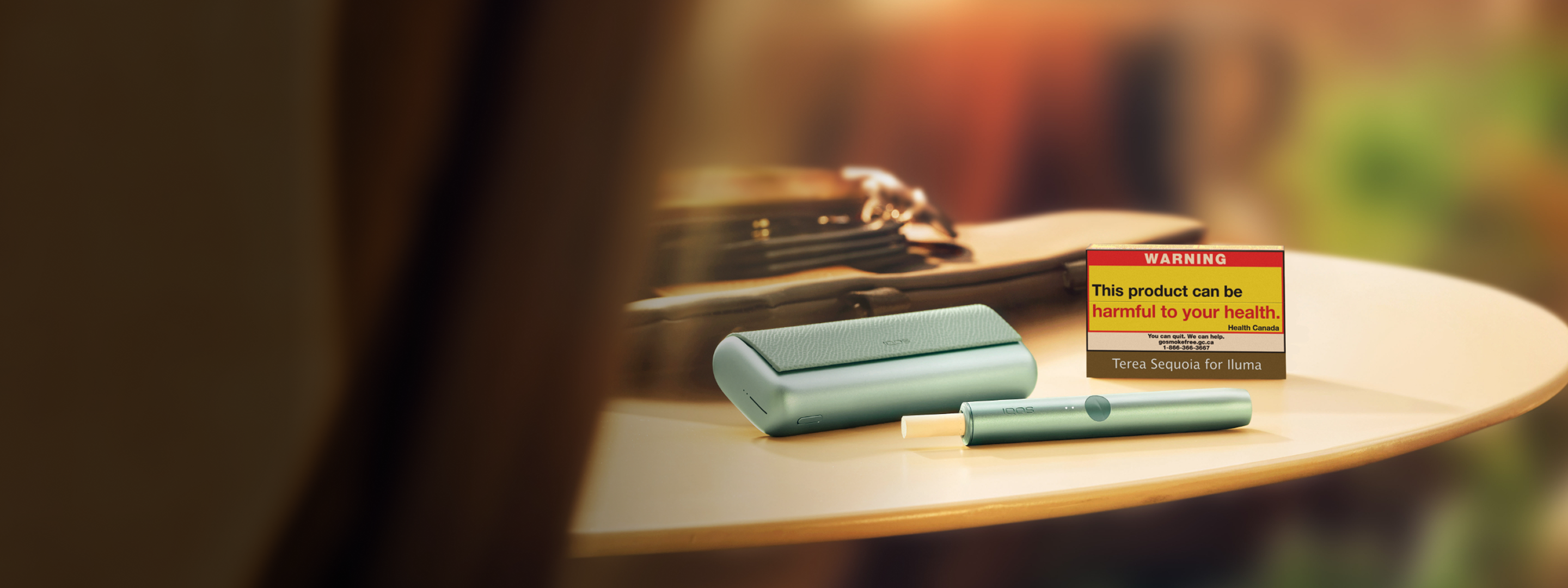 A Jade Green IQOS ILUMA PRIME Pocket Charger and Holder.
