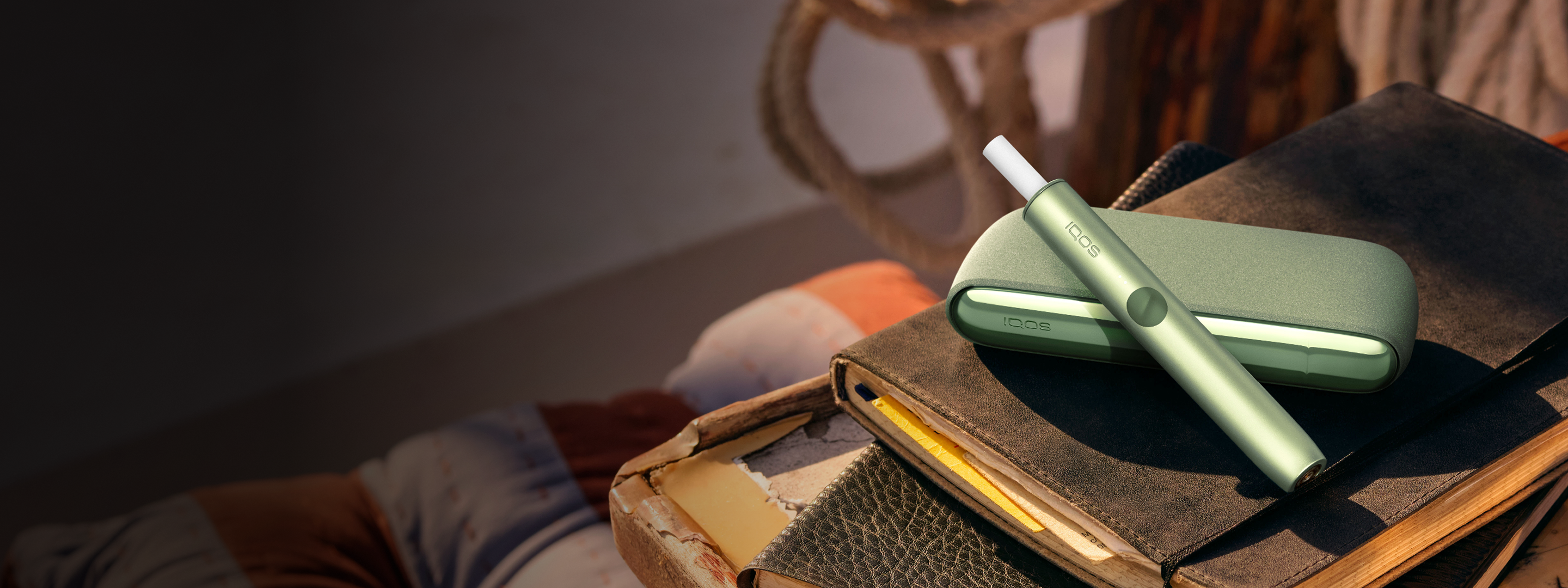 An IQOS ILUMA device on a table.