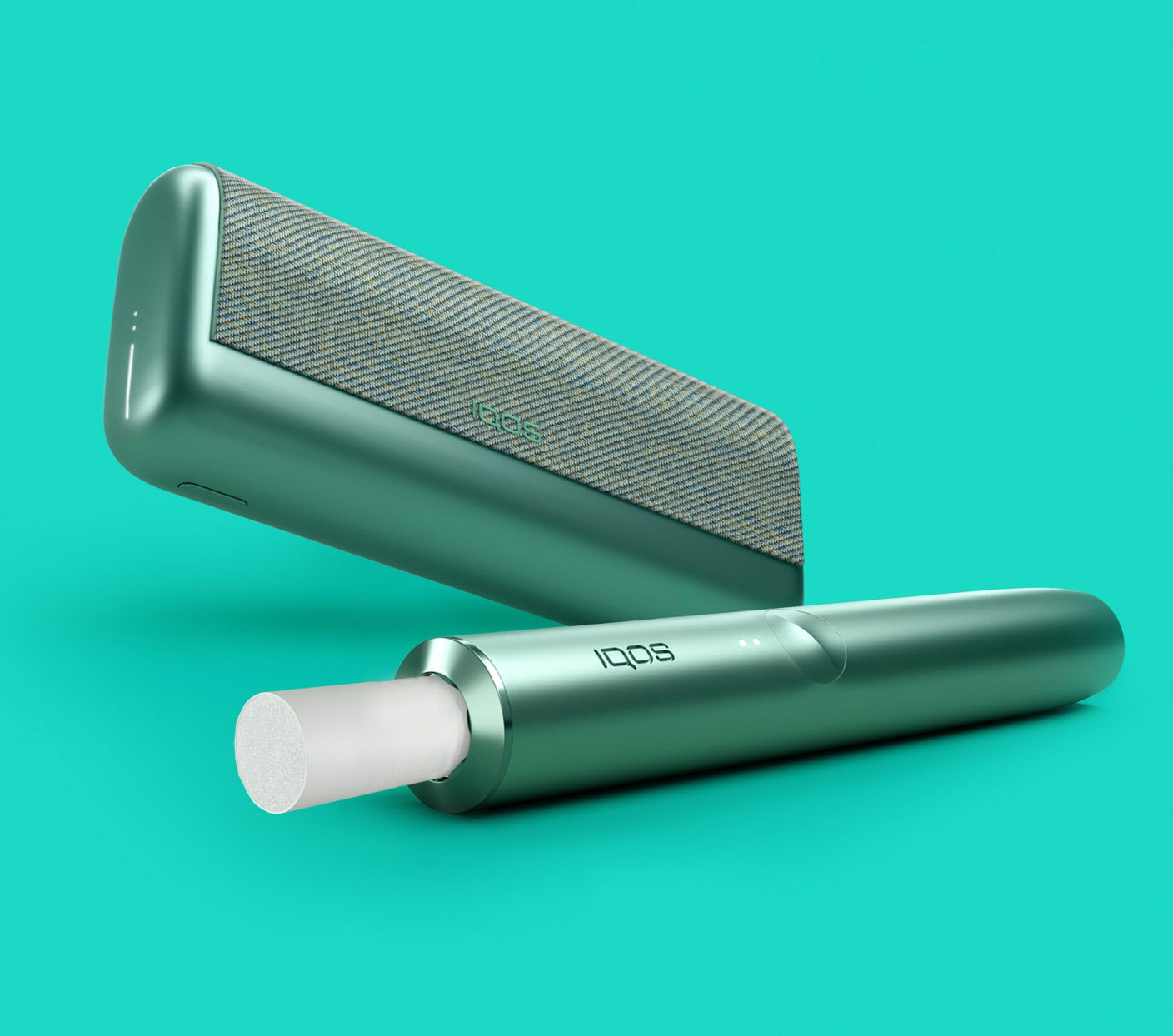 A jade green IQOS ILUMA PRIME holder and a matching device with a TEREA stick inserted.