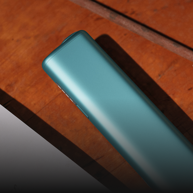 Un appareil IQOS ILUMA PRIME avec un bâtonnet TEREA à l’intérieur sur une surface.