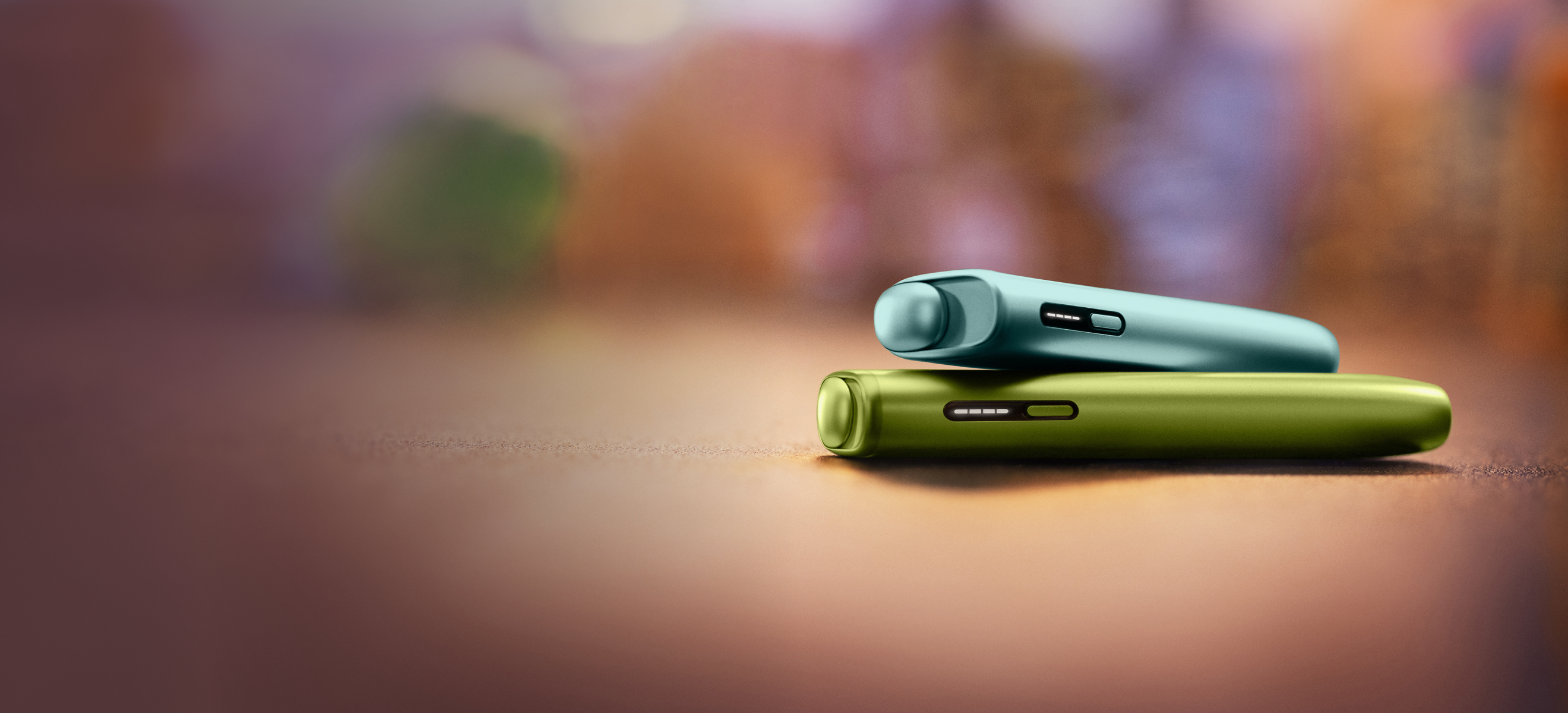 An IQOS ILUMA Holder and Pocket Charger.