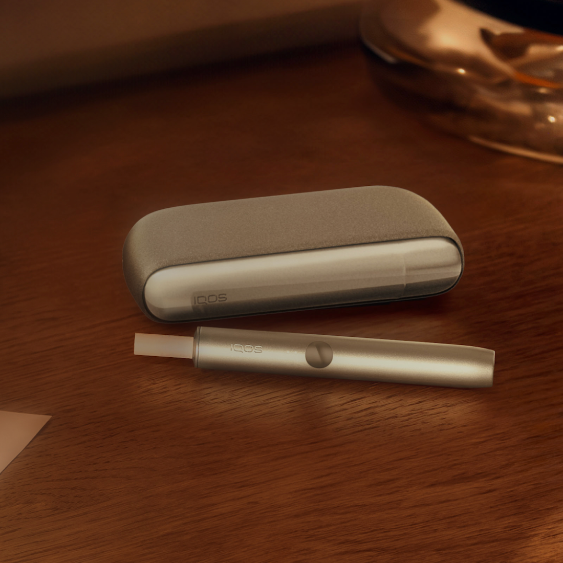 An IQOS ILUMA Pocket Charger and Holder.