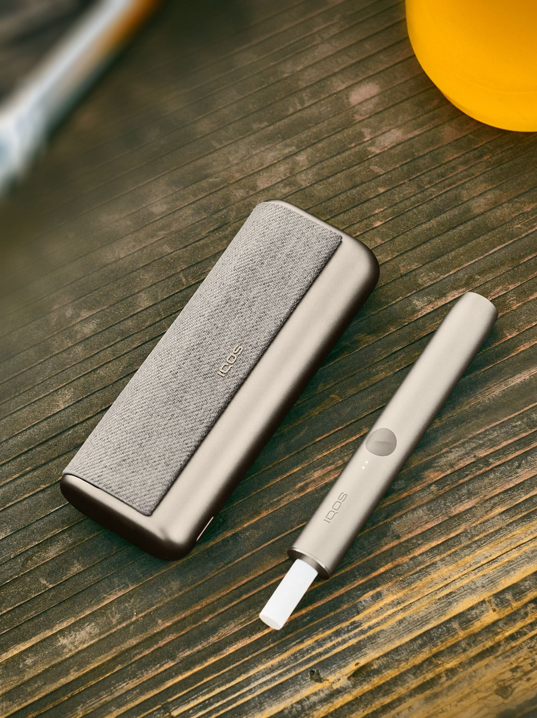 An IQOS ILUMA PRIME Holder and Pocket Charger.