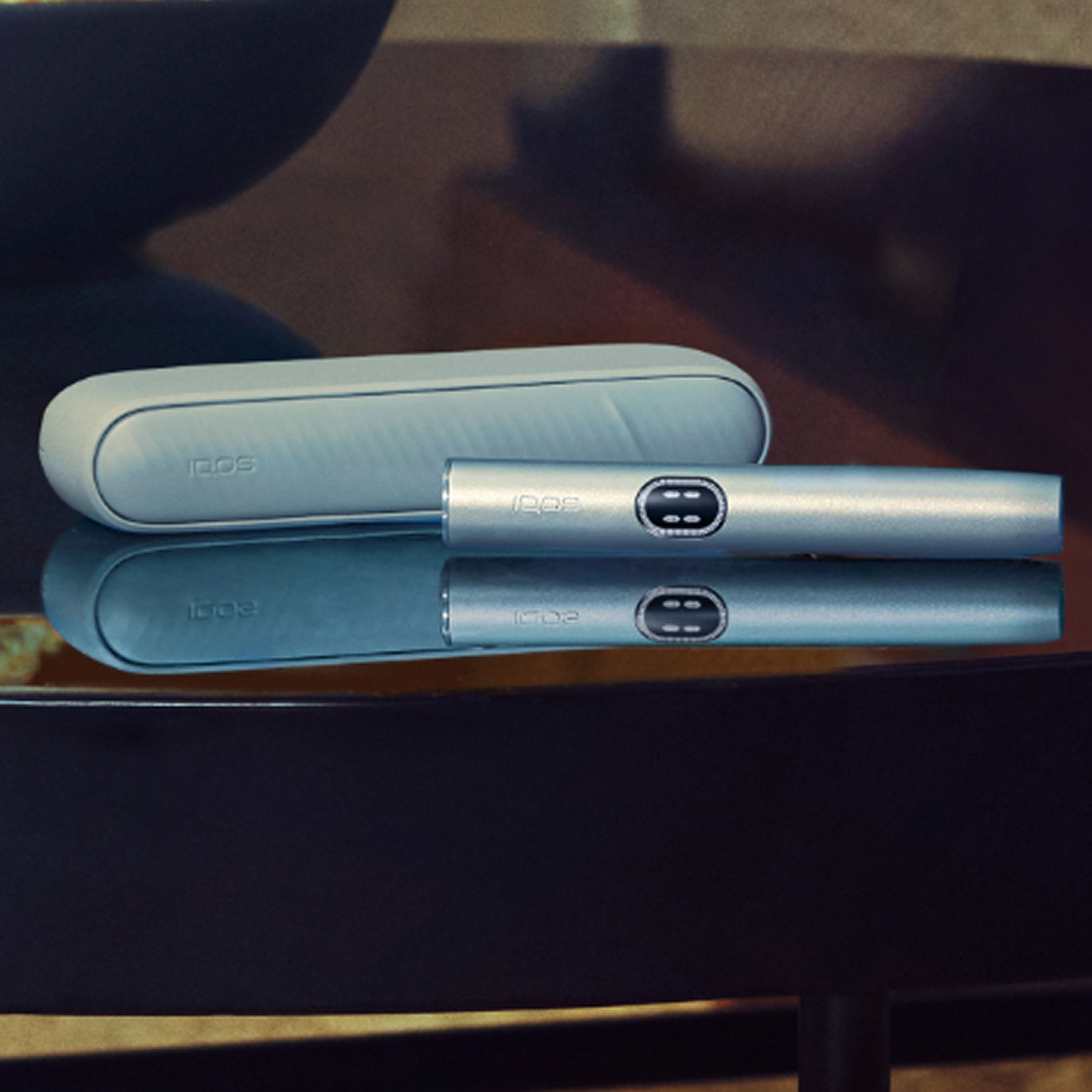 A Breeze Blue IQOS ILUMA i device on a table.
