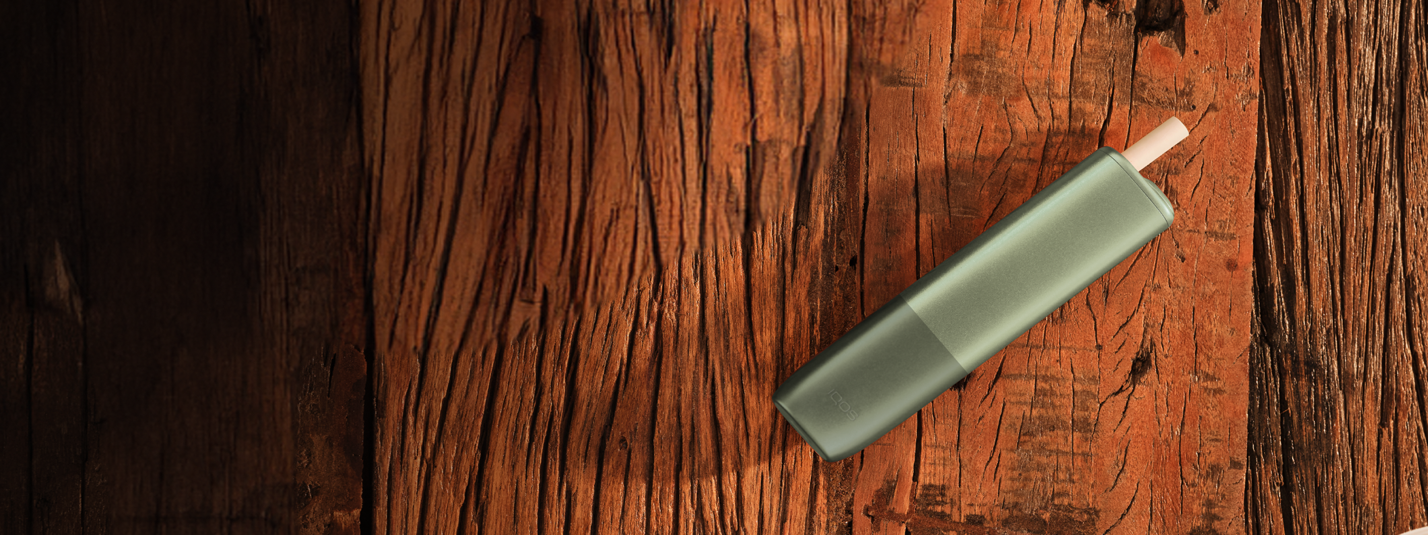 A Jade Green IQOS ILUMA Pocket Charger and Holder.