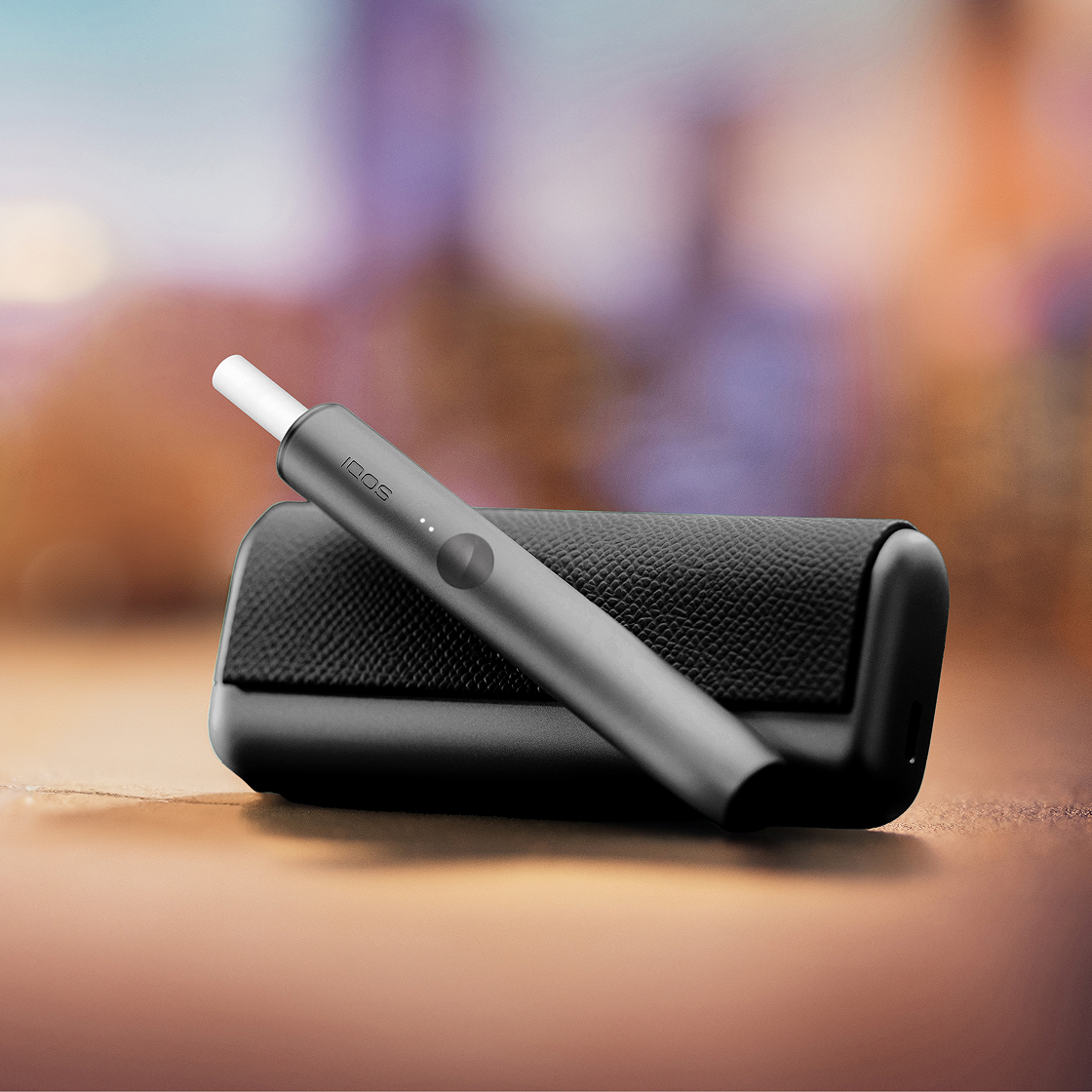 A Jade Green IQOS ILUMA PRIME Holder and Charger.