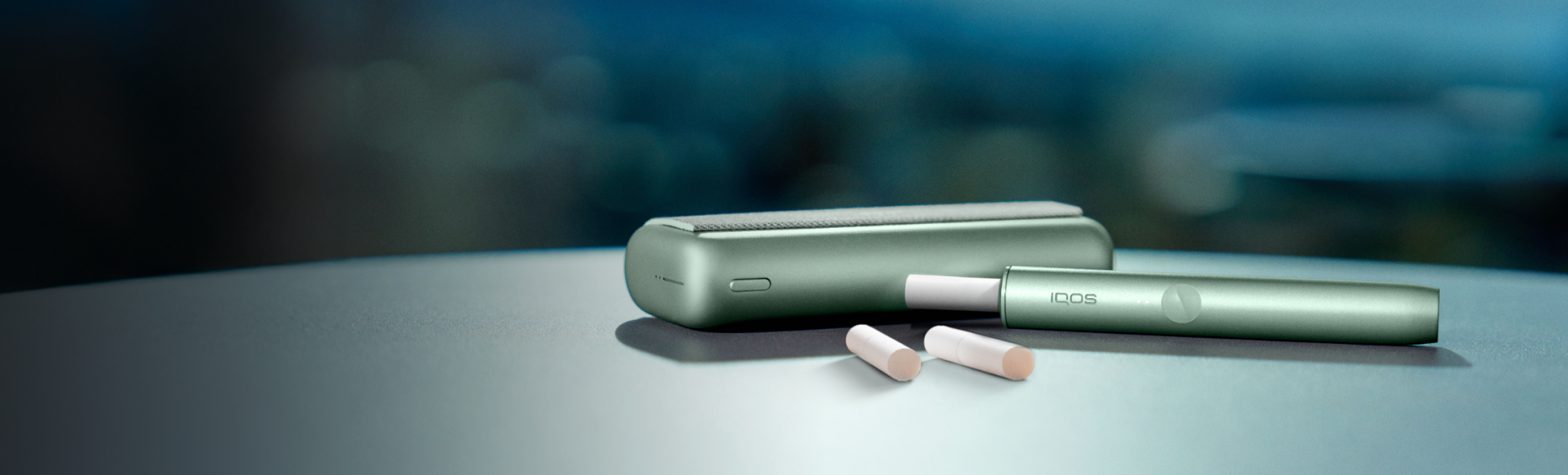 An IQOS ILUMA Holder and Pocket Charger.