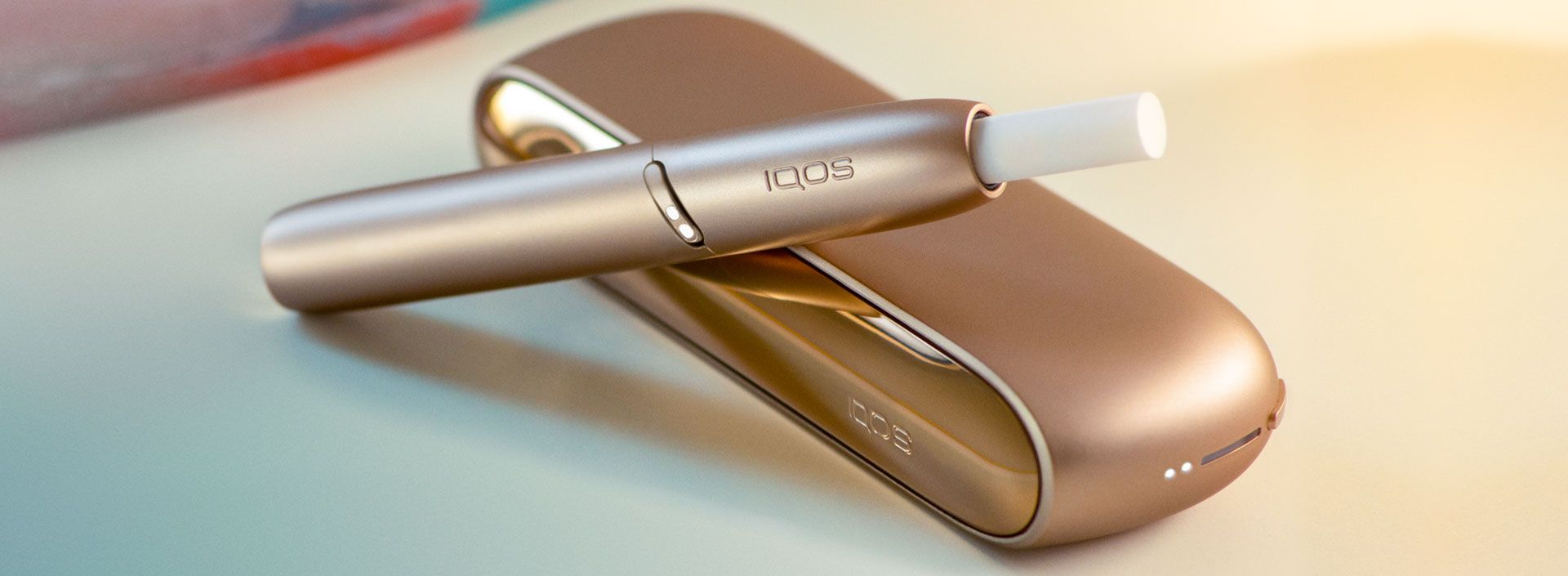 IQOS 3 DUO in Brilliant Gold and HEETS